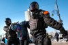 Police officers detain a man during a protest against the jailing of opposition leader Alexei Navalny in Vladivostok, Russia, on Sunday, Jan. 31, 2021. As part of a multipronged effort by the authorities to discourage Russians from attending Sunday's demonstrations, the Prosecutor General's office ordered the state communications watchdog, Roskomnadzor, to block the calls for joining the protests on the internet. (AP Photo/Aleksander Khitrov)