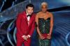 Chris Pizzello - Chris Pizzello/Invision/AP
Simu Liu, left, and Tiffany Haddish present the award for best international feature film at the Oscars.