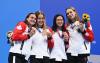 ATTILA KISBENEDEK - AFP via GETTY IMAGES
From left, Canada's Kylie Masse, Sydney Pickrem, Margaret MacNeil and Penny Oleksiak pose with their medals from the women's 4x100-metre medley at the Tokyo Olympics.
