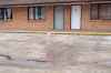 Blood stains the parking lot of the Capri Motel on Pembina Highway where a violent dog attack occurred early Saturday morning. (Daniel Crump / Winnipeg Free Press)