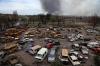 Alexei Alexandrov - The Associated Press
Damaged and burned vehicles are seen at a destroyed part of the Illich Iron & Steel Works Metallurgical Plant, as smoke rises from the Metallurgical Combine Azovstal during heavy fighting, in an area controlled by Russian-backed separatist forces in Mariupol, Ukraine on Monday.