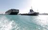 - - SUEZ CANAL AUTHORITY/AFP via Get
A picture released by Egypt's Suez Canal Authority on Monday shows a tugboat pulling the Panama-flagged MV 'Ever Given' container ship after it was fully dislodged from the banks of the Suez.