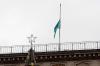 ALEXANDR BOGDANOV - AFP via GETTY IMAGES
A Kazakh state flag flies at half-mast on the roof of an administrative building in central Almaty on Monday.