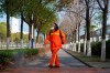 A worker wearing a face mask sprays disinfectant along a path in Wuhan in central China's Hubei Province, Tuesday, Jan. 28, 2020. China's death toll from a new viral disease that is causing global concern rose by 25 to at least 106 on Tuesday as the United States and other governments prepared to fly their citizens out of the locked-down city at center of the outbreak. (AP Photo/Arek Rataj)