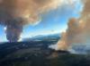 - BC Wildfire Service/AFP via Gett
This file handout photo courtesy of BC Wildfire Service shows two plumes of smoke from the Long Loch wildfire and the Derrickson Lake wildfire on June 30.