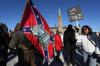 DAVE CHAN - AFP via GETTY IMAGES
A person carries a Confederate flag during the Freedom Convoy protest in front of Parliament on Saturday. “Every political party has its own gaggle of objectionable supporters,” Supriya Dwivedi writes. “Ideally, though, a party’s official strategy doesn’t include trying to actively appeal to them.”