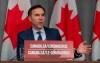 Minister of Finance Bill Morneau responds to a question during a news conference in Ottawa, Friday, March 27, 2020. THE CANADIAN PRESS/Adrian Wyld