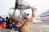 Brady Oliveira carries the Grey Cup across the tarmac as the team arrives home from Hamilton Monday afternoon. (Mike Deal / Winnipeg Free Press)

211213 - Monday, December 13, 2021.