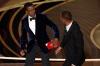 Chris Pizzello - Chris Pizzello/Invision/AP
Presenter Chris Rock, left, reacts after being hit on stage by Will Smith while presenting the award for best documentary feature at the Oscars on Sunday.