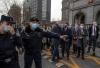 Kevin Frayer - GETTY IMAGES
Police ask journalists to move back as diplomats request entry to the trial for Canadian Michael Kovrig at a court in Beijing, China.