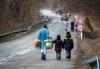 PETER LAZAR - AFP via GETTY IMAGES
A woman and two children walk across the Ukrainian border in the Slovakian city of Ubla on Feb. 25, 2022, following Russia's invasion of Ukraine.