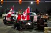 Nathan Denette - THE CANADIAN PRESS
A trucker supporter sits on a couch as they block the access leading from the Ambassador Bridge, linking Detroit and Windsor.