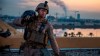 In this Saturday, Jan. 4, 2020, photo, released by the U.S. military, a U.S. Marine with 2nd Battalion, 7th Marines that is part of a quick reaction force, carries a sand bag during the reinforcement of the U.S. embassy compound in Baghdad, Iraq, Jan. 4, 2020. The blowback over the U.S. killing of a top Iranian general mounted Sunday, Jan. 5 as Iraq's Parliament called for the expulsion of American troops from the country — a move that could allow a resurgence of the Islamic State group. (U.S. Marine Corps photo by Sgt. Kyle C. Talbot via AP)