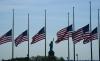 TIMOTHY A. CLARY - AFP via GETTY IMAGES
US flags, across New York Bay from the Statue of Liberty, fly at half-mast at Liberty State Park in Jersey City, New Jersey, on May 25, 2022, as a mark of respect for the victims of the May 24 shooting at Robb Elementary School in Uvalde, Texas.