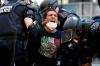 Alex Brandon - AP FILE PHOTO
A demonstrator is taken into custody by police after a curfew took effect during a protest over the death of George Floyd on June 1, 2020, near the White House in Washington.