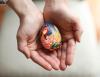 Richard Lautens - Toronto Star
Tetyana Vodoviz cradles a pysanka she created that depicts a woman sewing her country back together. During this Easter season, several artists have created pysanky that reflect the hopes and fears for their war-torn homeland.