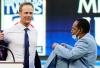 Jim Mone - AP
With an assist from baseball great Rod Carew, right, Justin Morneau trades his suit jacket for a Twins Hall of Fame blazer on Saturday night at Target Field.