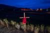 JONATHAN HAYWARD - THE CANADIAN PRESS
A child’s dress is seen on a cross outside the Residential School in Kamloops, B.C., on Saturday. The remains of 215 children were recently discovered buried near the former Kamloops Indian Residential School.