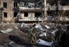 - AFP via Getty Images
A Ukrainian soldier inspects the rubble of a destroyed apartment building in Kyiv on March 15 after strikes on residential areas killed at least two people.