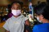 Seth Wenig - The Associated Press
Jenelle Camille, 11, receives her COVID-19 vaccination at in Englewood, N.J., this month. The U.S. was a couple of weeks ahead, but Health Canada has approved the Pfizer vaccine for kids five to 11.