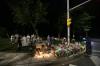 Steve Russell - Toronto Star
People return leave flowers and light candles at the spot where four members of the Afzaal family were killed Sunday evening.