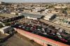 PATRICK T. FALLON - AFP via GETTY IMAGES
An aerial picture taken on June 24, 2021 shows cars waiting to cross into the United States from Mexico on the Paso del Norte International Bridge over the Rio Grande at the US-Mexico border between El Paso and the Mexican city of Ciudad Juarez, Chihuahua state, Mexico, in El Paso, Texas.