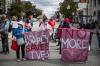 DARRYL DYCK - THE CANADIAN PRESS
People hold banners during a march to remember those who died during the overdose crisis and to call for a safe supply of illicit drugs on International Overdose Awareness Day, in Vancouver, on Aug. 31, 2021.