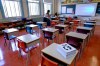 Grade one teacher Heidi Dimou arranges the desks in line with physical distancing policy in her class in preparation for the new school year at the Willingdon Elementary School in Montreal, on Wednesday, August 26, 2020. THE CANADIAN PRESS/Paul Chiasson