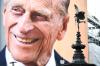 Jeff Spicer - GETTY IMAGES
Shaftesbury Memorial Fountain is seen in front of the photograph and notice of Prince Philip, Duke of Edinburgh's death is displayed on the large screen at Piccadilly Circus on April 0, 2021 in London.