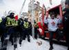 Cole Burston - THE CANADIAN PRESS
A man steps out of truck as police move in to clear downtown Ottawa of protesters after weeks of demonstrations on Feb. 19, 2022.