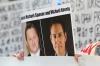 JASON REDMOND - AFP via Getty Images file photo
Protester holds a photo of detained Canadians Michael Spavor, left, and Michael Kovrig outside a court appearance for Huawei CFO, Meng Wanzhou, at the British Columbia Supreme Court in Vancouver.