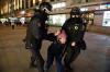 Denis Kaminev - AP
Police officers detain a woman in Moscow, Russia, Friday, Feb. 25, 2022. Shocked Russians turned out by the thousands Thursday to decry their country's invasion of Ukraine as emotional calls for protests grew on social media. Some 1,745 people in 54 Russian cities were detained, at least 957 of them in Moscow.