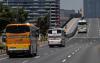 Carl Court - GETTY IMAGES
Buses drive over Toyosu Ohashi Bridge toward the Tokyo Olympics athletes village. Buses are one of the benchmarks of delivering any Olympics, because it is the lifeblood of moving people around.