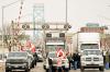 GEOFF ROBINS - AFP via GETTY IMAGES
Supporters of the truckers against the Covid-19 vaccine mandate block traffic in the Canada bound lanes of the Ambassador Bridge border crossing, in Windsor, on Tuesday.