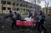 Evgeniy Maloletka - The Associated Press
Emergency workers and volunteers carry an injured pregnant woman outside a damaged maternity hospital in Mariupol, Ukraine.