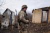 Evgeniy Maloletka - AP
A Ukrainian serviceman stands at his position at the line of separation between Ukraine-held territory and rebel-held territory near Svitlodarsk, eastern Ukraine, on Wednesday, Feb. 23, 2022.