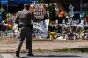 Jae C. Hong - AP
A state trooper carries a sign to be placed at a memorial honoring the victims killed in the elementary school shooting in Uvalde, Texas.