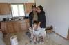 Geordie Rae Jr. hugs his wife Rose and their son Lucas, 3, in their newly-renovated kitchen. The family didn't have running water, a kitchen sink or a proper bathroom before. 
(JOE BRYKSA / WINNIPEG FREE PRESS)