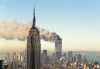 The twin towers of the World Trade Center burn behind the Empire State Building in New York, Tuesday, Sept. 11, 2001. In a horrific sequence of destruction, terrorists crashed two planes into the World Trade Center and the twin 110-story towers collapsed. Explosions also rocked the Pentagon and the State Department and spread fear across the nation.  (Marty Lederhandler / The Associated Press)