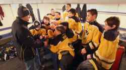 JOE BRYKSA / WINNIPEG FREE PRESS Rivers Pee Wee Jets coach Daren Stanick gives a pep talk to his players in Foxwarren.