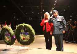 Wendy Hayward, mother of Cpl. James Arnal who was killed while serving in Afghanistan, lays a wreath.