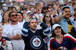 RUTH BONNEVILLE / WINNIPEG FREE PRESS
Thousands of Winnipeg Jets fans scream at the start of Game 1 of Western Conference final between the Jets and Las Vegas Golden Knights game outside Bell MTS Place druing the Whiteout street party Saturday, May 12, 2018.