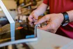 SASHA SEFTER / WINNIPEG FREE PRESS
Sarmatiuk prepares a book of sheet music to be retrofitted to a coil binding by winding the coil.