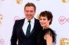 FILE - Actor Damian Lewis and partner actress Helen McRory pose for photographers on arrival at the 2019 BAFTA Television Awards in London, May 12, 2019. Lewis is among hundreds of Britons honored by Queen Elizabeth II on Wednesday as she celebrates 70 years on the throne. Lewis, 51, was recognized for services to drama and charity. He and his wife Helen McCrory raised money for a charity providing meals to health care workers during COVID-19 lockdowns. McCrory, an actor who starred in TV drama “Peaky Blinders,” died of cancer in 2021 aged 52. (Photo by Grant Pollard/Invision/AP, File)