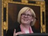 Employment, Workforce Development and Disability Inclusion Minister Carla Qualtrough smiles as she speaks to media after tabling a bill in the House of Commons Thursday, June 2, 2022 in Ottawa. THE CANADIAN PRESS/Adrian Wyld