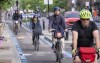 Cyclists make their way down the REV -- Reseau Express Velo -- on St-Denis Street during the morning commute in Montreal on Thursday, June 2, 2022. THE CANADIAN PRESS/Paul Chiasson