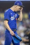 Los Angeles Dodgers starting pitcher Walker Buehler walks off the field after being pulled by manager Dave Roberts during the third inning of a baseball game against the New York Mets in Los Angeles, Saturday, June 4, 2022. (AP Photo/Alex Gallardo)