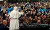 FILE - Pope Benedict XVI waves to faithful and to a group of soldiers in Coppito, near L'Aquila, Italy, Tuesday April 28, 2009. Pope Francis added fuel to rumors about the future of his pontificate on Saturday by announcing he would visit the central Italian city of L'Aquila in August for a feast initiated by Pope Celestine V, one of the few pontiffs who resigned before Pope Benedict XVI stepped down in 2013. (AP Photo/Sandro Perozzi, File)