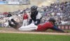 Minnesota Twins' Byron Buxton beats the tag by New York Yankees catcher Jose Trevino to score from third base on a sacrifice fly by Max Kepler during the first inning of a baseball game Tuesday, June 7, 2022, in Minneapolis. (AP Photo/Jim Mone)