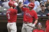 Philadelphia Phillies' Bryce Harper is congratulated by J.T. Realmuto after hitting a home run during the seventh inning of a baseball game against the Milwaukee Brewers Thursday, June 9, 2022, in Milwaukee. (AP Photo/Morry Gash)